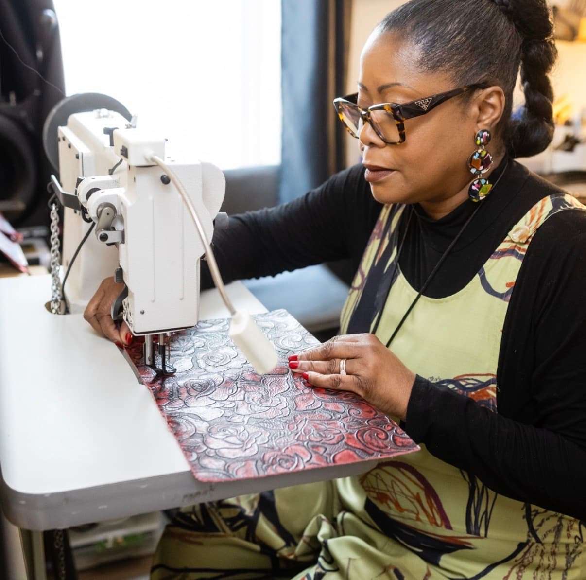 Marsha O. Bell at her sewing machine